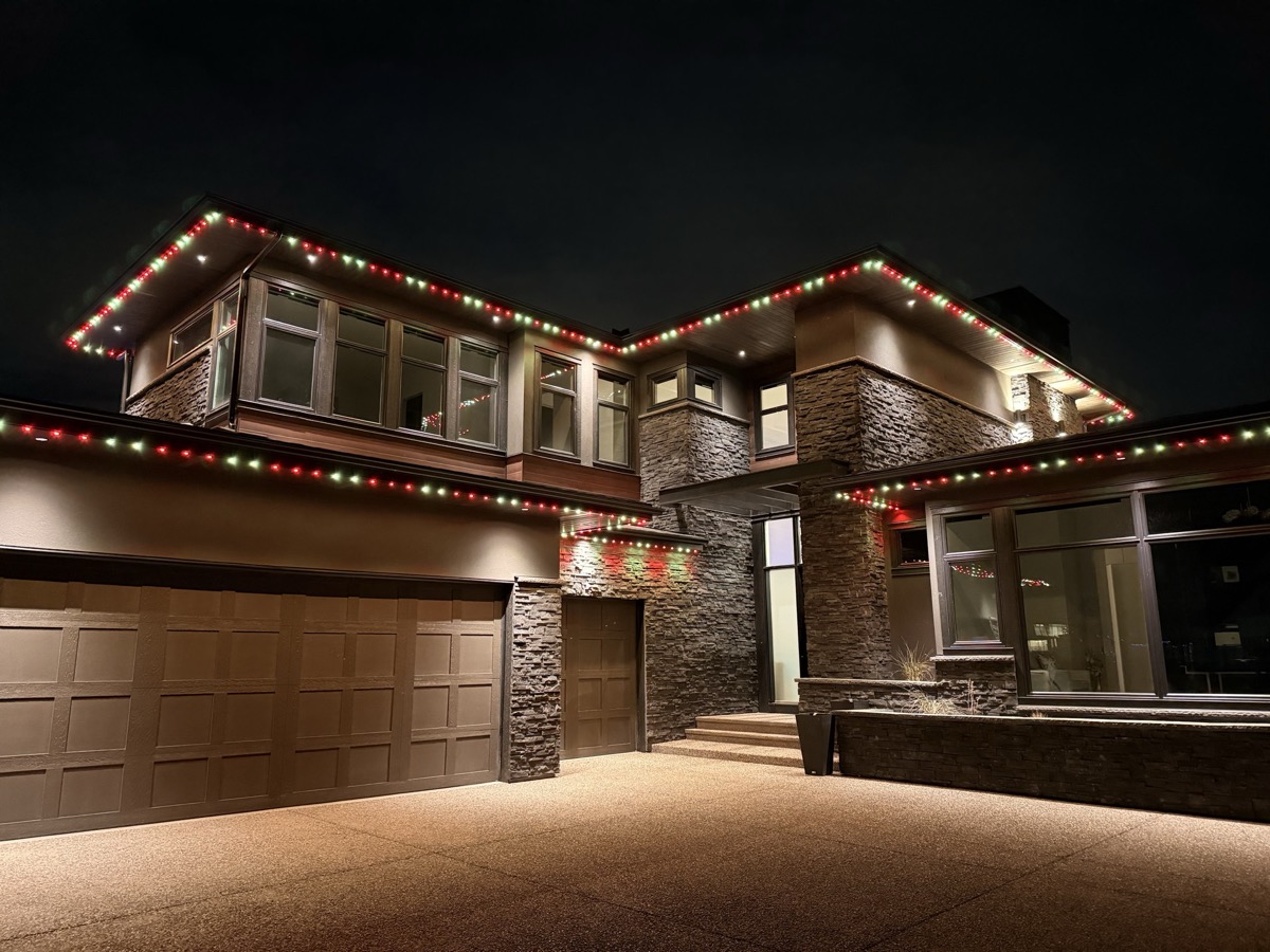 Calgary house lit up in team colors for game day using permanent LED lights